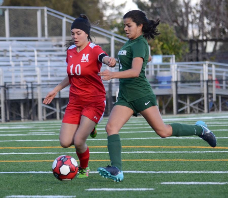 Varsity captain and senior Ria Gupta chases down a Mercy player during the senior night game. The seniors are definitely a very big part of our team, and they bring a lot of energy and technique to the field, she said. They’re all such kind and loving people, and they really make this team feel like a family for a lot of us, and so it’s important that we have this one night for them to show them how much we really appreciate them and all the hard work they’ve put in these past years.
