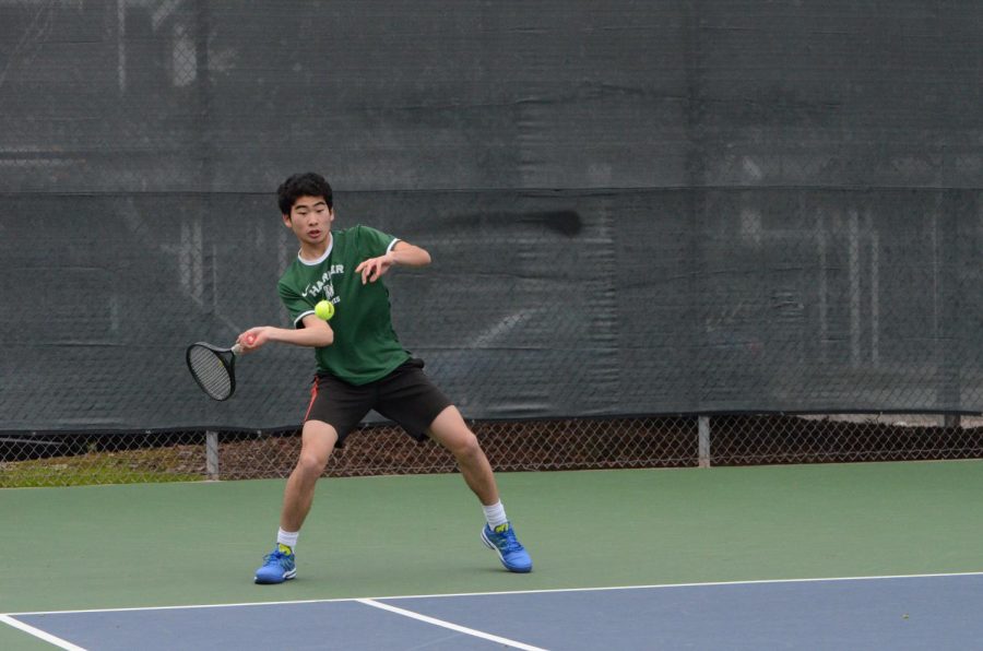 Richard Hu (11) hits the ball during the match last Monday against Nueva. The boys play tomorrow at Sacred Heart. 