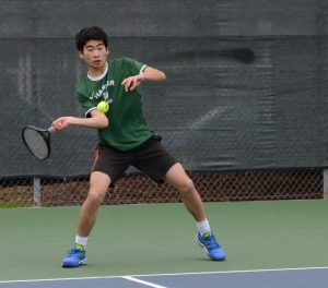 Richard Hu (11) hits the ball during the match last Monday against Nueva. The boys play tomorrow at Sacred Heart. 