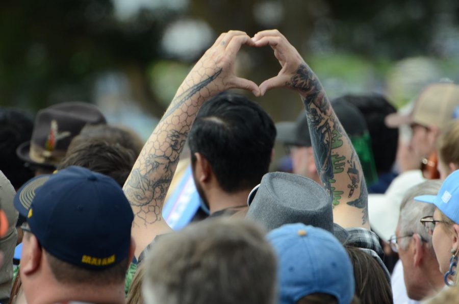 A supporter holds up a heart during Sanders' speech at the rally.