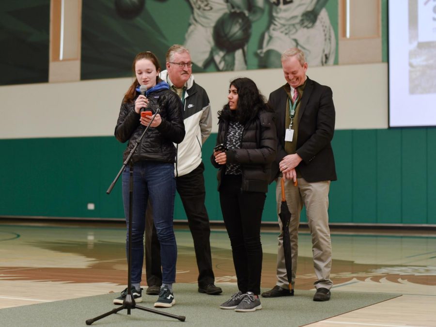 Members of Green Team Ashley Jazbec (11) and Anvi Banga (11), joined by Head of School Brian Yager and Upper School Head Butch Keller, announce that the cafeteria will no longer provide single-use plastic as a part of an initiative for environmental sustainability.