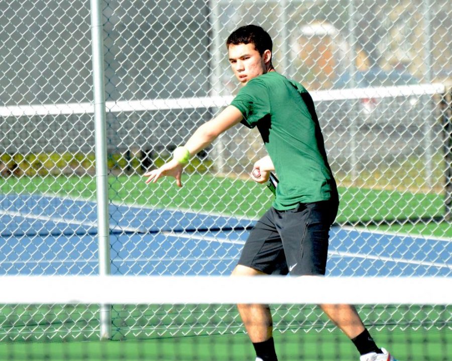 Kai Franz (12) returns the ball during the match against Kings on Monday. Their overall record now stands at 4-1.  
