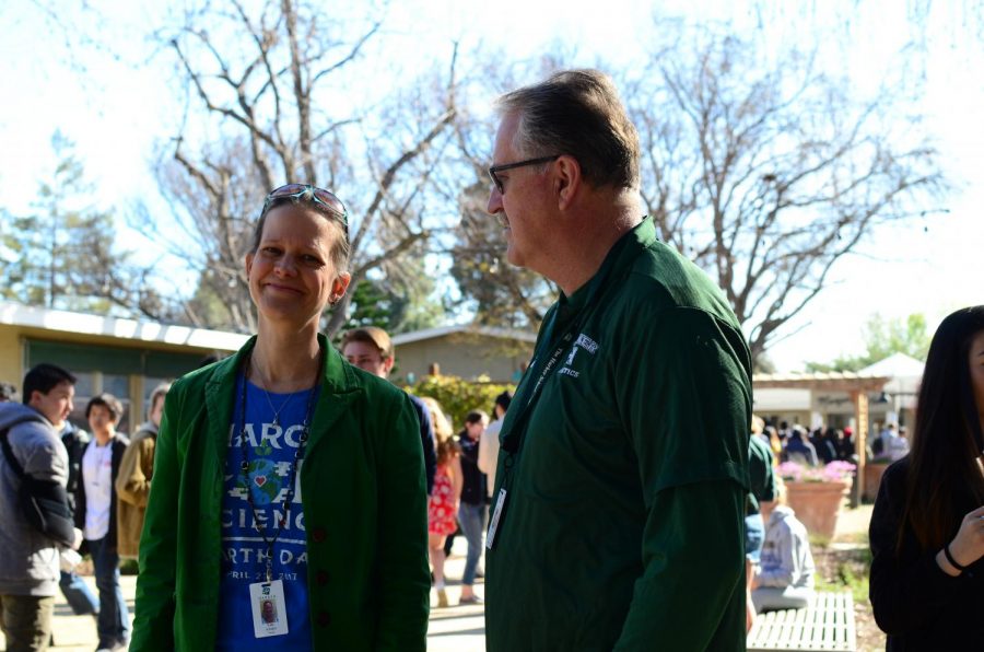Dr. Kate Schafer and Mr. Greg Lawson laugh as they don green tops in supoort of the Youth Climate Strike. All students and faculty were encouraged to wear blue or green to show their support. 