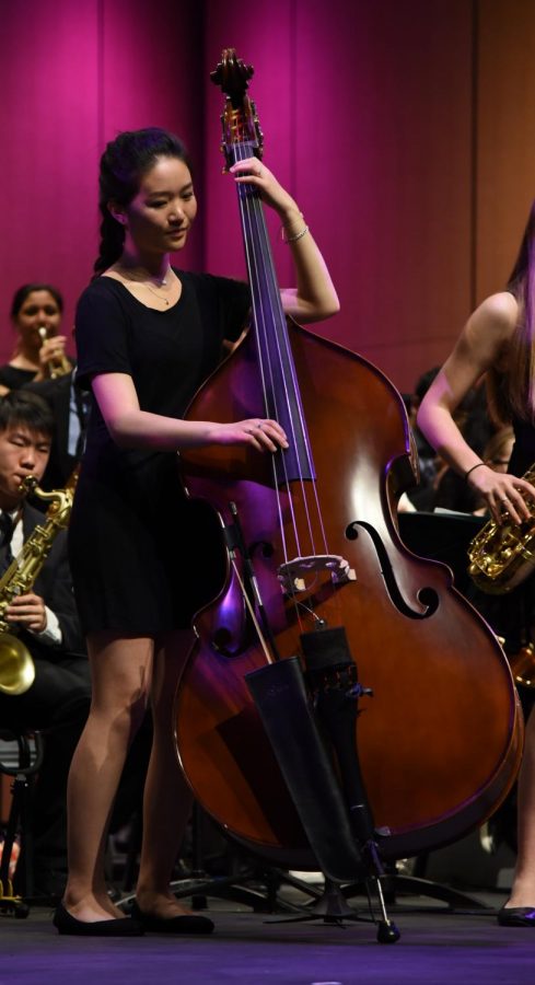 Connie Xu (12) plays the upright bass as a member of the upper schools Jazz Band. Connie was one of the seniors honored at the end of the night.