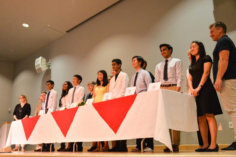 This years Near Mitra scholars line up on stage for a photo after signing copies of their papers. The ceremony that concluded the yearlong scholarship process was held in the Nichols Auditorium last Tuesday.