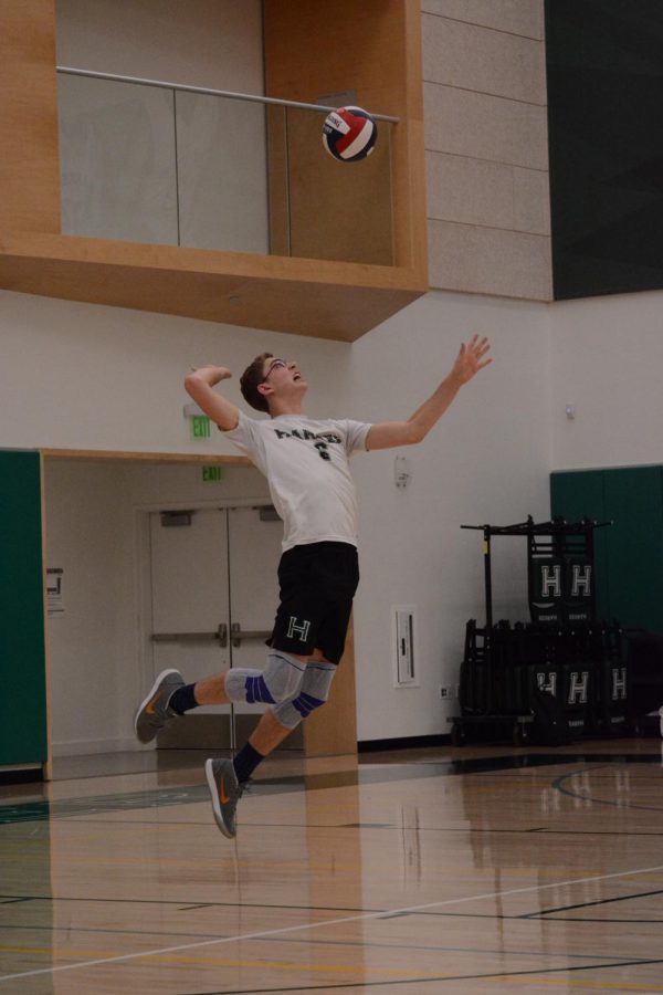 Liam Bakar (11) serves in a varsity game against Los Gatos. The Eagles won the game 3-0. 