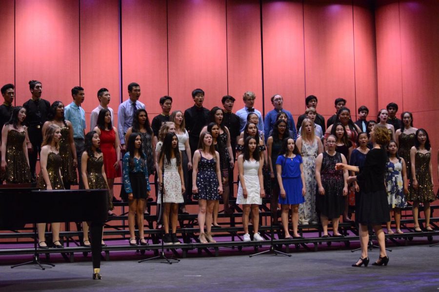 All upper school choral performers finished last Fridays concert with a closing song, Carly Simons Let the River Run. The concert, which was the ensembles senior night, honored senior vocalists after this final performance.
