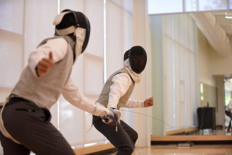 After-school fencing class tries electric fencing