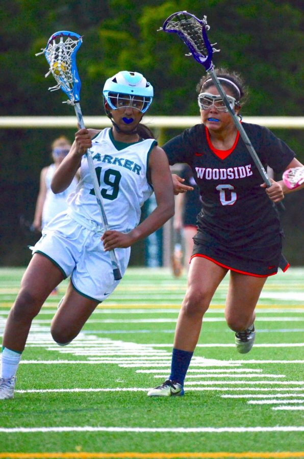 Anna Vazhaeparambil (10) cradles the ball as she runs past a defender, aiming for the opponents’ goal in the semifinals. The girls lost 9-6 to Woodside. 
