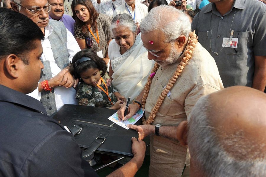 Prime Minister signs an autograph for a supporter following his victory last Thursday. Modi secured a landslide victory over his opponents, securing his second term in office. 