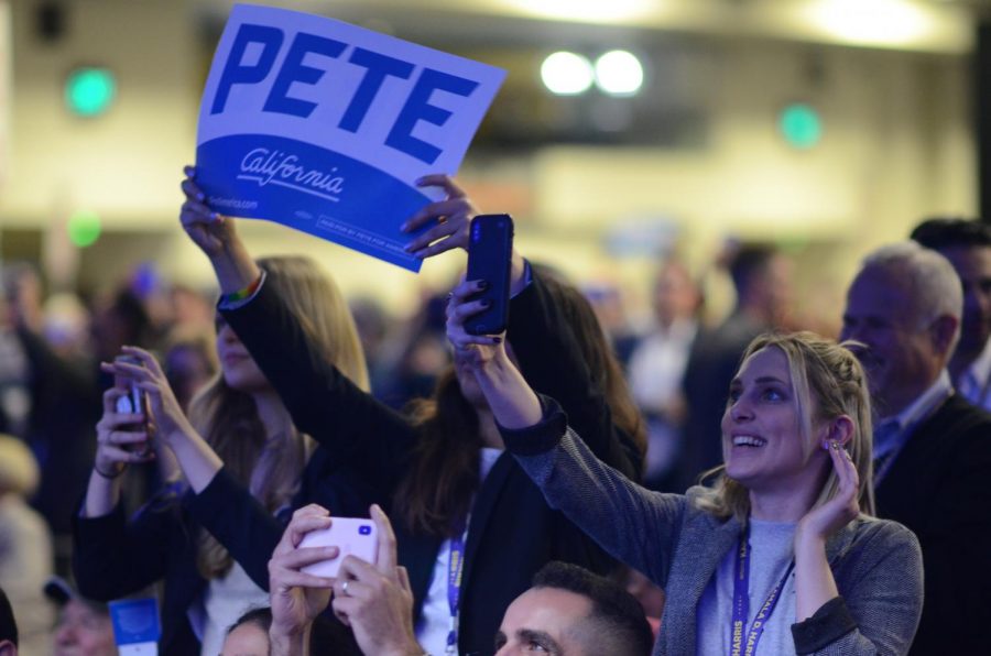 Supporters of "Mayor Pete" wave banners and cheer during his speech at the CDP general session this afternoon.