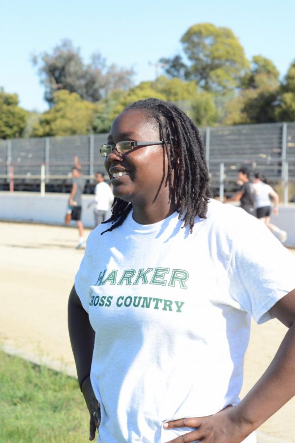 Mia Purnell watches her cross-country athletes warm-up on the track at the Blackford Campus.