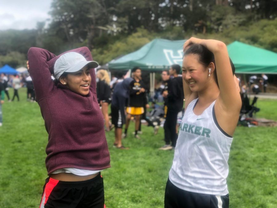 Seniors Vani Mohindra and Annabelle Ju warm up ahead of their race at the Lowell Invitational. The team will compete in their second meet of the season at the Jackie Henderson Memorial Invitational next Saturday. 