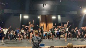 Upper school dance teacher Karl Kuehn looks on as students audition for the annual dance production. Auditions took place on Sept. 14.