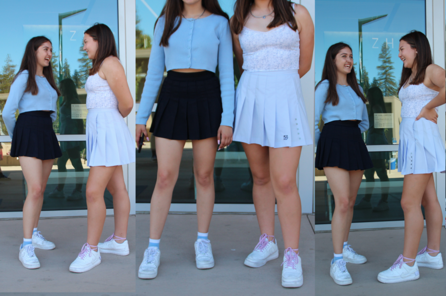 Ava Lett (10) is clad in a navy pleated skirt with a pastel blue sweater and Nike Air Force Ones. Ainsley Mariko (10) sports a floral print tank top, pale baby blue pleated skirt and white Nike Jesters. 
