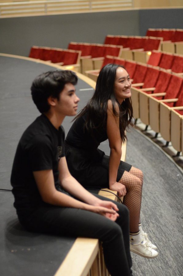 Katelyn Chen (12) and Joel Morel (12) listen to feedback from director Jeffrey Draper after rehearsing their scene.