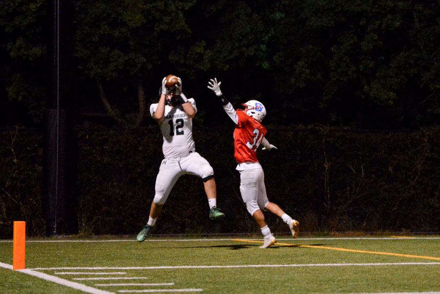 Marcus Anderson (11) catches a touchdown pass in the endzone.