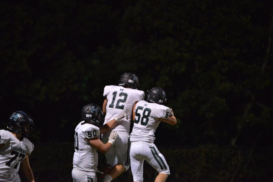 The Eagles celebrate their first touchdown of the night.