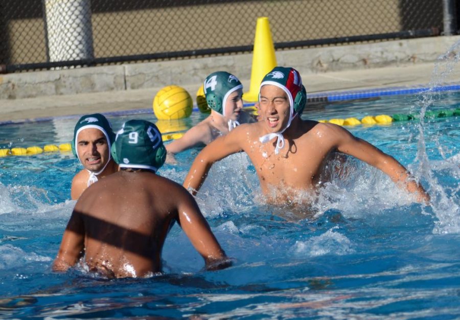 Alex Shing (12) hypes up the team ahead of their matchup against Cupertino. The boys came back in the second half to win 12-8.