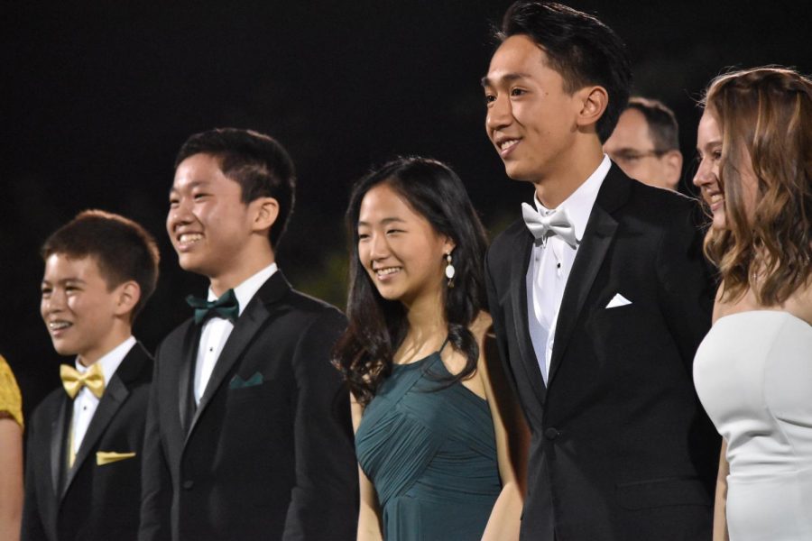 Rupert Chen (9), William Chien (10), Yejin Song (10), Nicholas Yi (11) and Calais Poirson (11) stand as part of the homecoming court. 
