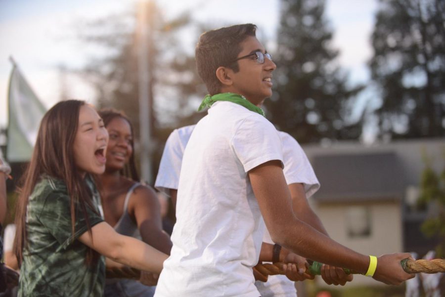 Sophomores Muthu Panchanatham and Alysa Suleiman pull during the tug of war contest, which the sophomores won. 