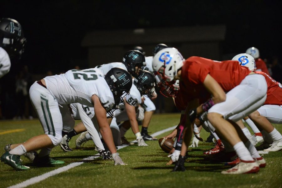 The teams assemble at the line of scrimmage.