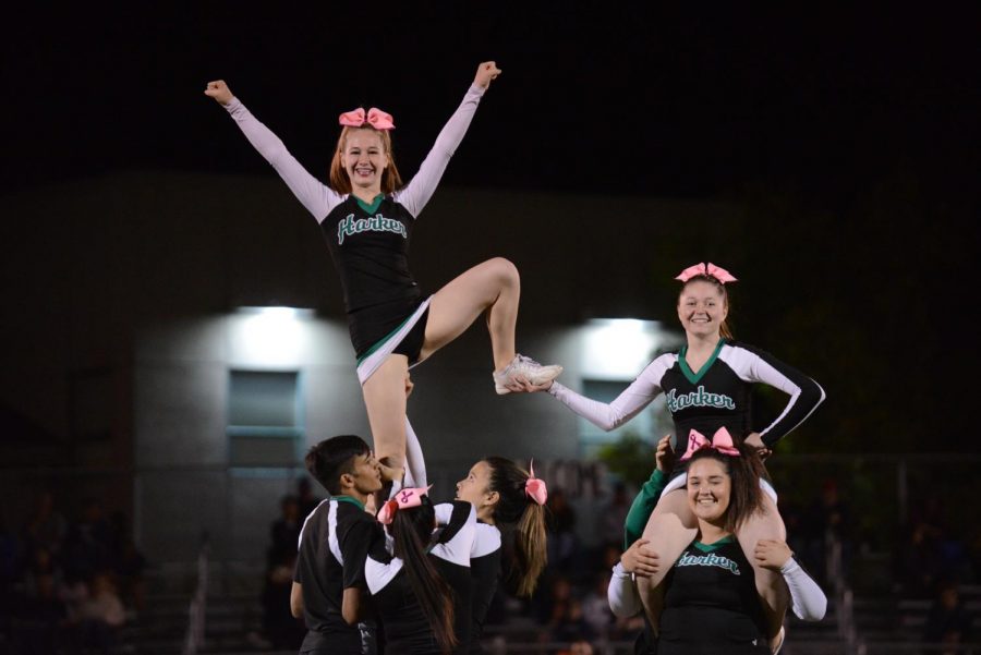 Members of the cheer squad perform during their halftime routine. 