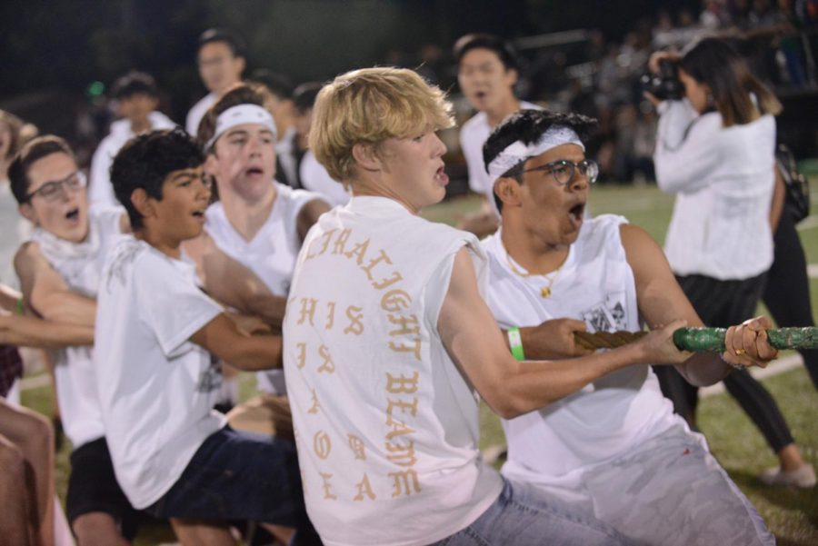 Junior tug-of-war participants defeat the seniors at halftime to take first place. 