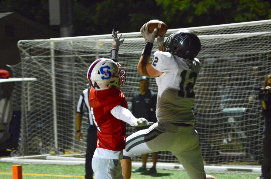 Marcus Anderson (11) catches a touchdown pass to score Harkers first points of the game. 