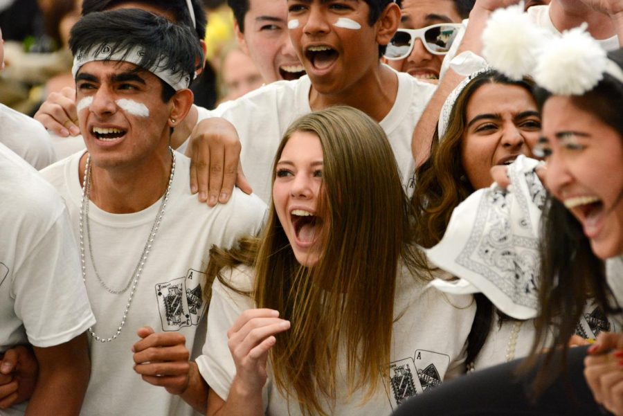 Juniors Sara Baicher and Arjun Virmani cheer for their class after hearing the results of the lip sync at the end of the rally on Oct. 11. The juniors placed first overall in the lip sync, with a routine that told the story of three juniors traveling to Los Angeles.