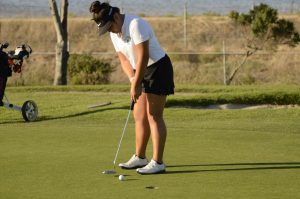 Natalie Vo (11) putts during the girls matchup against Castilleja on Oct. 7.  Natalie and Claire Chen (9) qualified for the State Championship as individuals. 