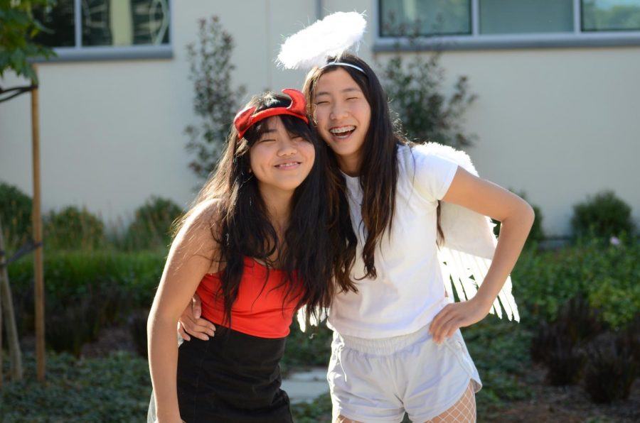Freshmen Allison Zhu and Alexis Nishimura dress as a devil and angel in classic red and white for the costume.
