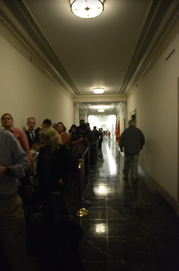 The line to witness the impeachment hearing spreads down the dimly lit hallway. People who waited could only enter if another person exited the room.