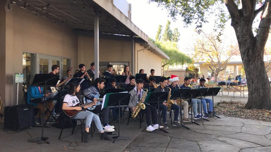 Jazz+band+performs+Christmas+songs+outside+the+auxiliary+gym+today+during+lunch.+Some+of+their+songs+included+Christmas+classics+Winter+Wonderland+and+Santa+Claus+is+Coming+to+Town.