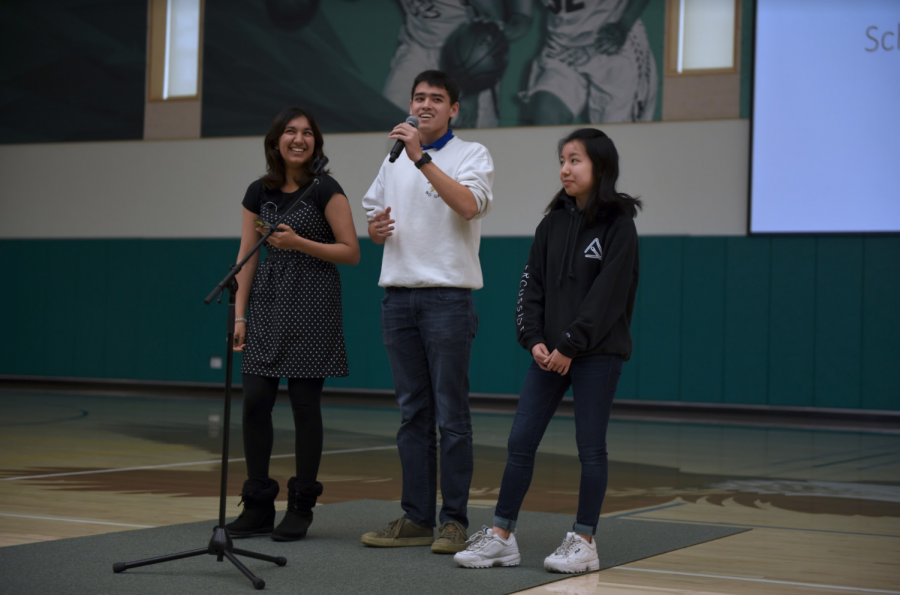 Presidents of the Chinese National Honor Society (CNHS), French National Honor Society (FNHS) and Japanese National Honor Society (JNHS) Sana Pandey (12), Grant Miner (12) and Katie Chang (12), respectively from left to right, announce the three clubs upcoming shared club week. The three clubs will take turns selling cultural snacks during lunch and after school this week.