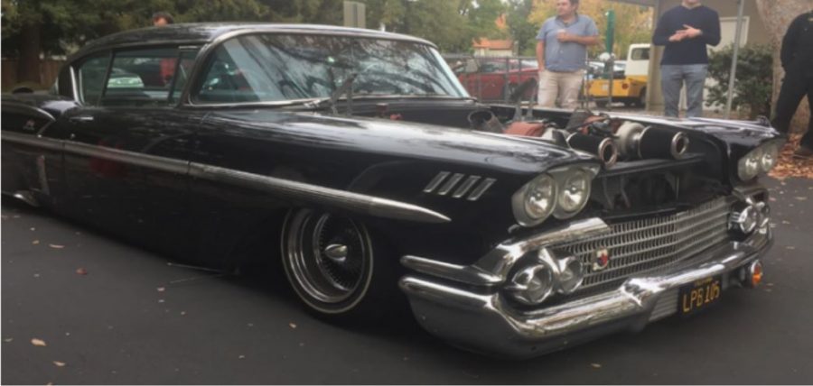 A 1958 Chevrolet Impala with a Corvette LS1 engine drives into Harker for the car show. The Harker Car Show will take place Nov. 23 in the upper school parking lot, hosted by Harker Car Club.