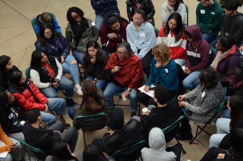 Attendees at the second annual Student Diversity Leadership Gathering participate in the fishbowl activity. In the “fishbowl activity,” chairs were set up in the center of the room with people of color in the middle and white people forming a ring around them. Featured speaker and organizer Dr. Rodney Glasgow showed three videos to prompt discussion.