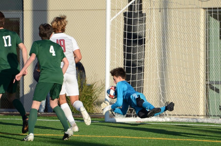 Lazlo Bollyky (10) saves a Sacred Heart goal during the matchup on Wednesday. The game ended in a 3-3 tie. 