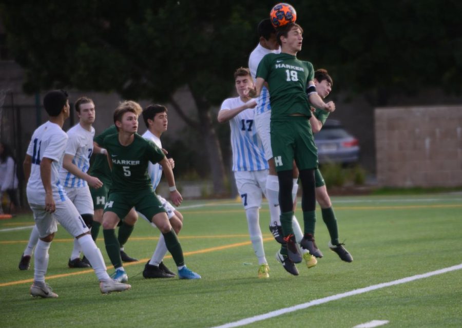 Andrew Cheplyansky (12) controls the ball with a header during the varsity game against Leland last Wednesday. The varsity team will play Crystal Springs in an away conference game this Wednesday at 3:30 p.m.