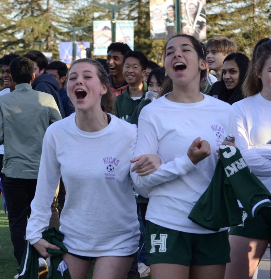 Varsity girls soccer players Sarah Baicher (11) and Emma Boyce (11) shout congratulations following the close win for the JV boys.