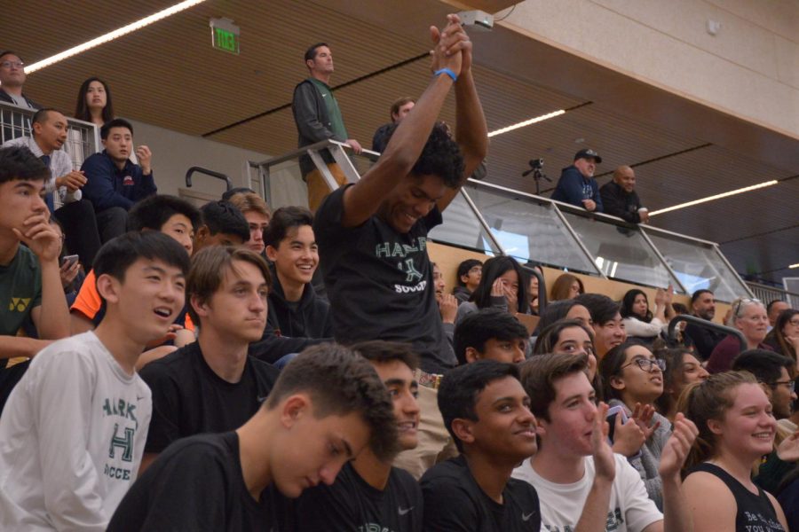 Shomrik Mondal (12) jumps up to cheer for the Eagles after a successful play. The bleachers were filled with fellow students supporting the team during their first round of CCS playoffs.