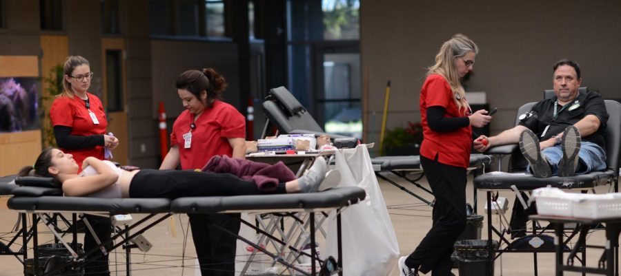 K-12 Production Manager Brian Larsen and Anna Arnaudova (11) prepare to have their blood drawn. Blood collected from Mondays blood drive will be sent to a Red Cross blood bank in Pomona, California to distribute to hospitals around the state. 
