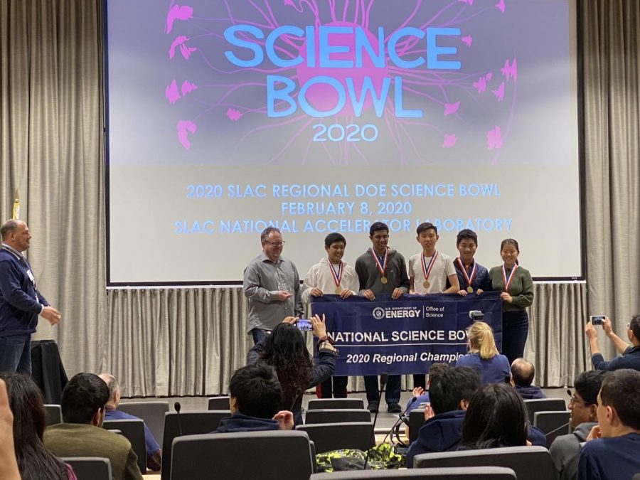 Members of the winning Science Bowl team pose with coach and upper school chemistry teacher Robbie Korin. The team won its third regional championship in four years.
