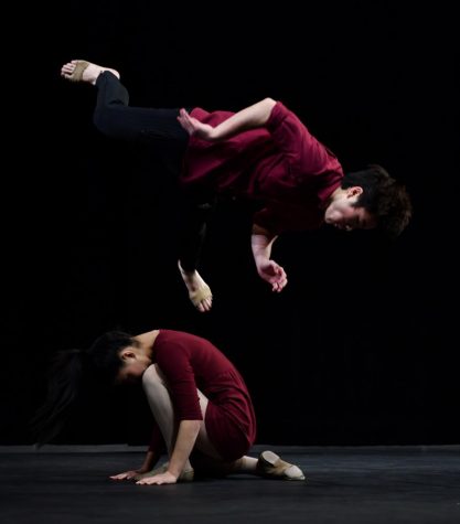 Vance Hirota (12) jumps over Chloe Chen (12) as a part of their contemporary dance to