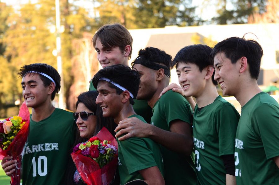 Seniors on the varsity boys soccer team pose for a picture during the halftime ceremony during their senior night matchup against Eastside  College Prep on Feb. 7.