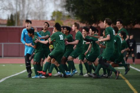 The varsity soccer team celebrates after clinching the CCS championship 3-1 in penalty kicks after ending overtime tied at 1-1. During the penalty kicks, Andrew Cheplyansky (12), Justin Fung (10) and Darshan Chahal (12) all scored, and goalie Laszlo Bollyky (10) made two close saves, securing the win for the Eagles.