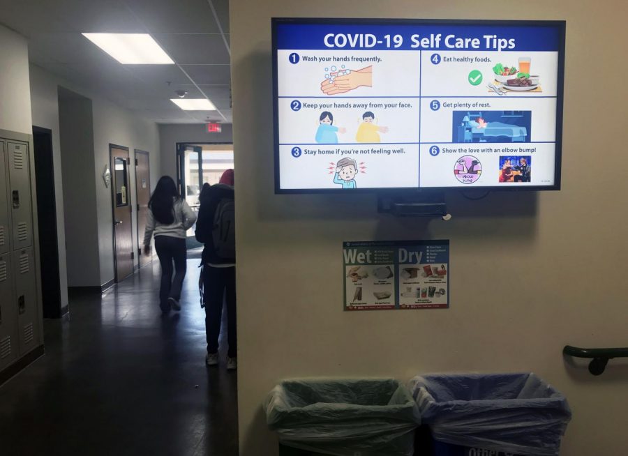 The TV screen in downstairs Shah displays tips on staying healthy during the coronavirus outbreak.