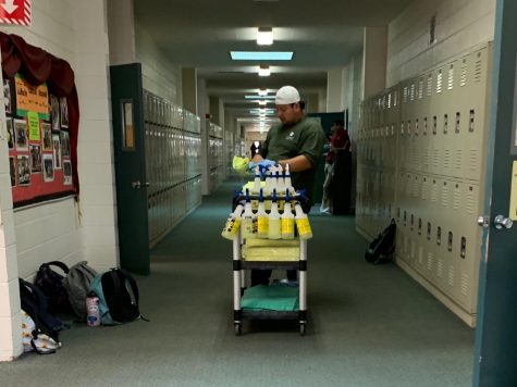A custodial worker cleans the classrooms in Main after school yesterday. Harker is taking extra precautionary actions to ensure the appropriate sanitation of its campuses.