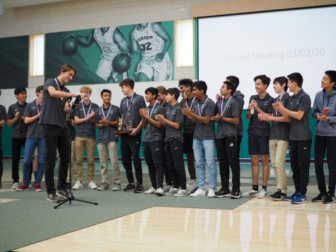 The varsity boys soccer team applauds after senior Andrew Cheplansky finishes speaking about the team's accomplishments this season. The boys won against Saint Francis on Saturday, winning their first CCS championship.