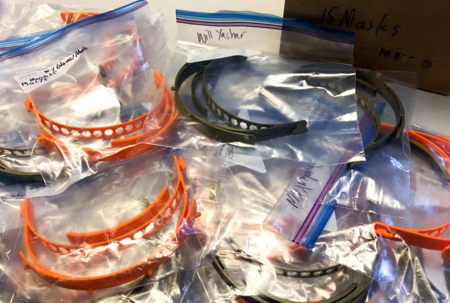 Parts of 15 orange and black masks that Will Yashar (10) 3D-printed lie on a table. “It was nice to see everyone helping for the common good, that was inspiring,” Will said. “Everyone’s helping in their own way, [this] was just the way I could help.”
